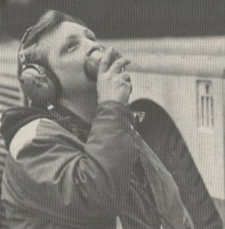 1981 A mechanic on pushback headset speaking to the pilots in the cockpit